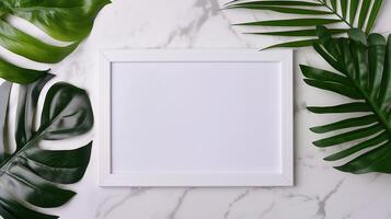 Blank frame mockup with green tropical leaves on marble background. Stylish natural composition foliage layout template advertising image. Mock up branding product, marketing material photo
