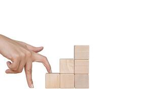 Fingers walking up blocks as stairs for concept about business and climbing up in seniority. photo