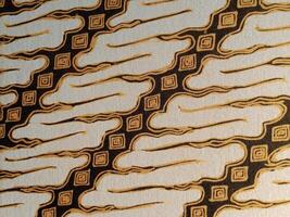 Batik pattern background. A close up of Javanese batik with a Parang Parung pattern. Indonesian batik photo