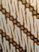Batik pattern background. A close up of Javanese batik with a Parang Parung pattern. Indonesian batik, photo