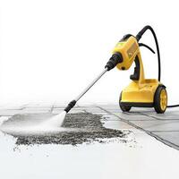 Yellow pressure washer cleaning a paved surface photo
