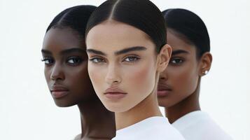 Three stunning models with unique features and skin tones display elegance and confidence in a clean, contemporary environment photo