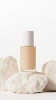 A skincare serum bottle stands elegantly on smooth white stones, showcasing a clean and modern aesthetic in soft, soothing lighting photo
