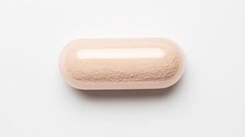 A small round pill on a white surface photo