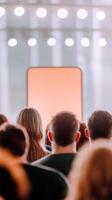 Audience attentively engages with a presentation on mobile app design focused on real estate solutions and user experience improvements photo