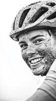 A cyclist grins joyfully, their face covered in mud, glowing with enthusiasm after navigating a tough trail surrounded by nature photo