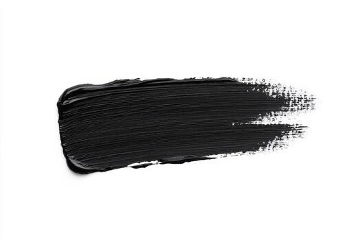 Long, smooth black paint stroke spreads across a white canvas, showcasing an artistic technique and creating a striking contrast in design photo