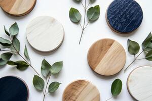 Stylish round wooden coasters in various colors surround fresh green leaves, enhancing the decor photo