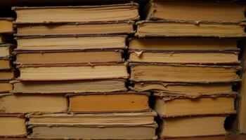 A stack of old books, their pages yellowed and brittle, with worn covers and faded titles. photo