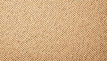 The texture of rough burlap fabric, showing the coarse weave and natural imperfections. photo