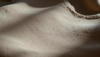 The play of light and shadow on a folded piece of fabric, creating depth and texture. photo