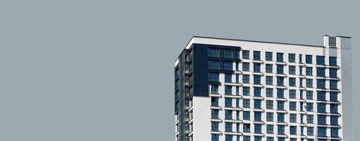 Building facade with modern design. Highrise condominium with apartment, office, and housing photo
