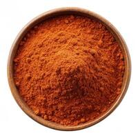 Rich paprika powder in a wooden bowl vibrant red tones spice culinary ingredient photo