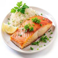 Grilled salmon fillet with rice lemon herbs soft light white plate photo