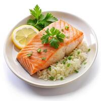 Delicious pan seared salmon with fluffy rice lemon and parsley garnish on a photo