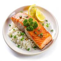 Delicious grilled salmon with rice lemon and parsley garnish bright studio photo