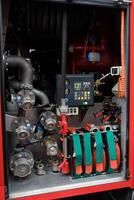 Detailed view of firefighting equipment in action during training exercises at a fire station in an urban area at midday photo