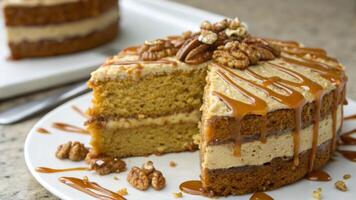 A slice of cake with caramel and walnuts on it photo