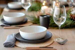 Christmas table setting decorated with candles and evergreen branches photo