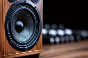 Wooden loudspeaker reproducing sound on blurred background photo