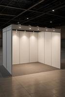 Clean White Exhibition Booth with Spotlights in Convention Center, Ideal for Branding and Display at Business Expo, Mockup Environment for Advertising and Trade Shows, Prominent Branding Space photo