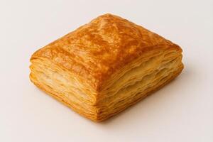 Golden Brown Puff Pastry with Flaky Layers and Crisp Texture on Clean Surface for Food Photography and Baking Concepts photo