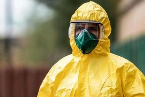 A man in a yellow suit and a green face mask photo