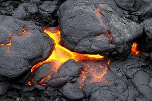 Lava flows from the ground in a volcano photo