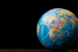 A globe on a black background with a black background photo