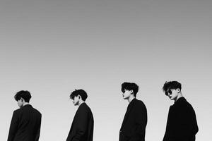 A group of men in suits standing in a line photo