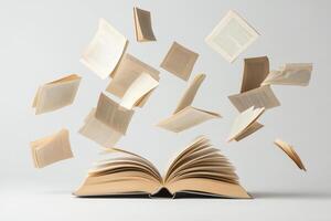 An open book with flying pages on a white background photo