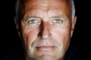 A close up of a man with a serious look photo