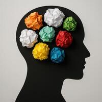 Creative Representation of Mental Health with Colorful Crumpled Papers in Head Silhouette on Gray Background photo