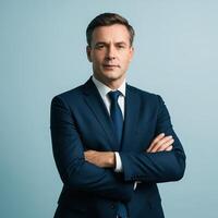 Confident Business Manager with Crossed Arms on Pale Blue Background Backlit photo
