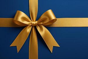 Elegant Golden Ribbon on Rich Blue Background for Celebratory and Festive Design Themes photo