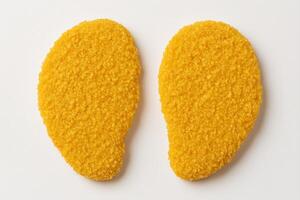Two Breaded Chicken Schnitzels with Golden Crispy Coating for Quick Meal Preparation photo