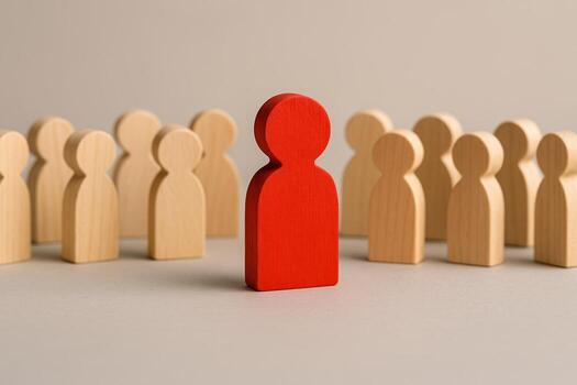 Red Figure Standing Out Among Crowd of Wooden Figures Symbolizing Unique and Talented Worker Successful Choice and Promotion Concept photo