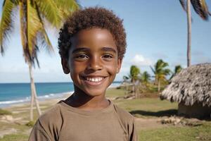 A young boy smiles at the camera while standing in front of palm trees photo