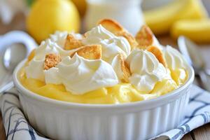 A bowl of dessert with whipped cream and bananas photo
