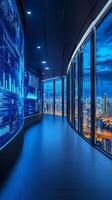 This location features a sleek corridor illuminated by blue data displays, revealing a stunning city skyline as dusk falls over the urban landscape photo