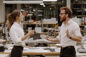 Two people talking in an office setting photo