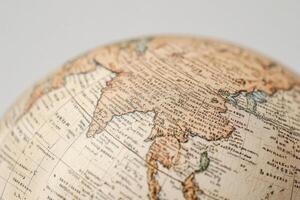 A close up of a globe with a map on it photo