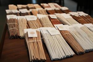 A table with many different types of incense sticks photo