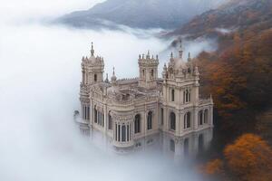 A castle in the clouds surrounded by fog photo