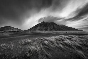 Black and white photograph of a mountain with clouds photo