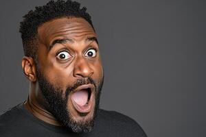 A man with a beard and a mouth open photo