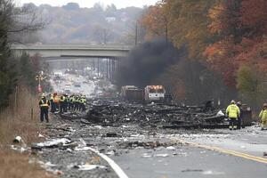 The wreckage of a plane that crashed into a field photo
