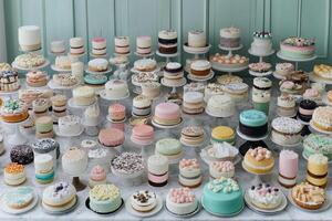 A table full of different types of cakes photo
