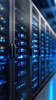 Server racks with glowing blue lights in data center photo
