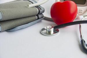 A stethoscope and a red heart shaped with customizable space for text. Medical and health concept photo